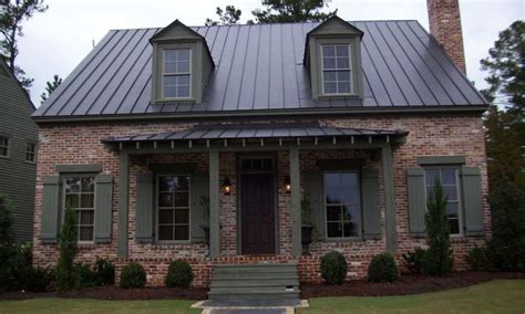 back metal roof on brick house|brick house with black shingles.